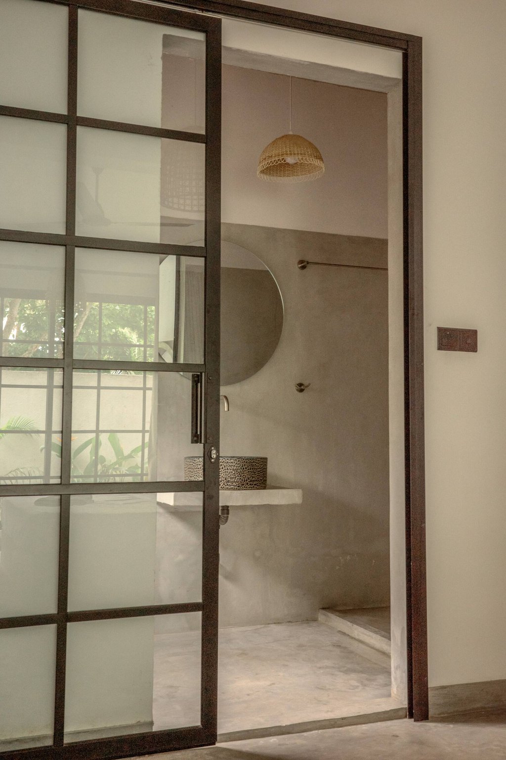 Casa bathroom through glass door