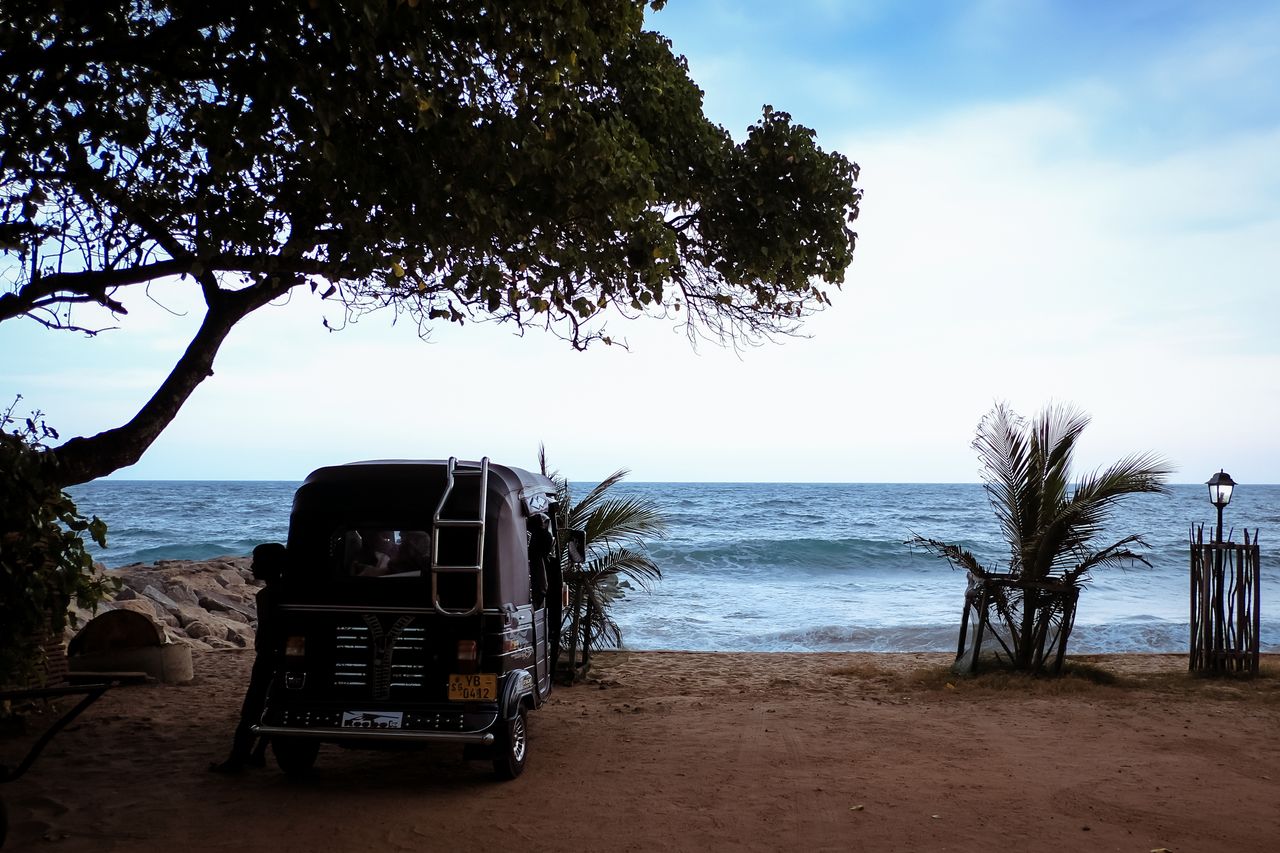 Tuk-tuk parked on a beach in Sri Lanka